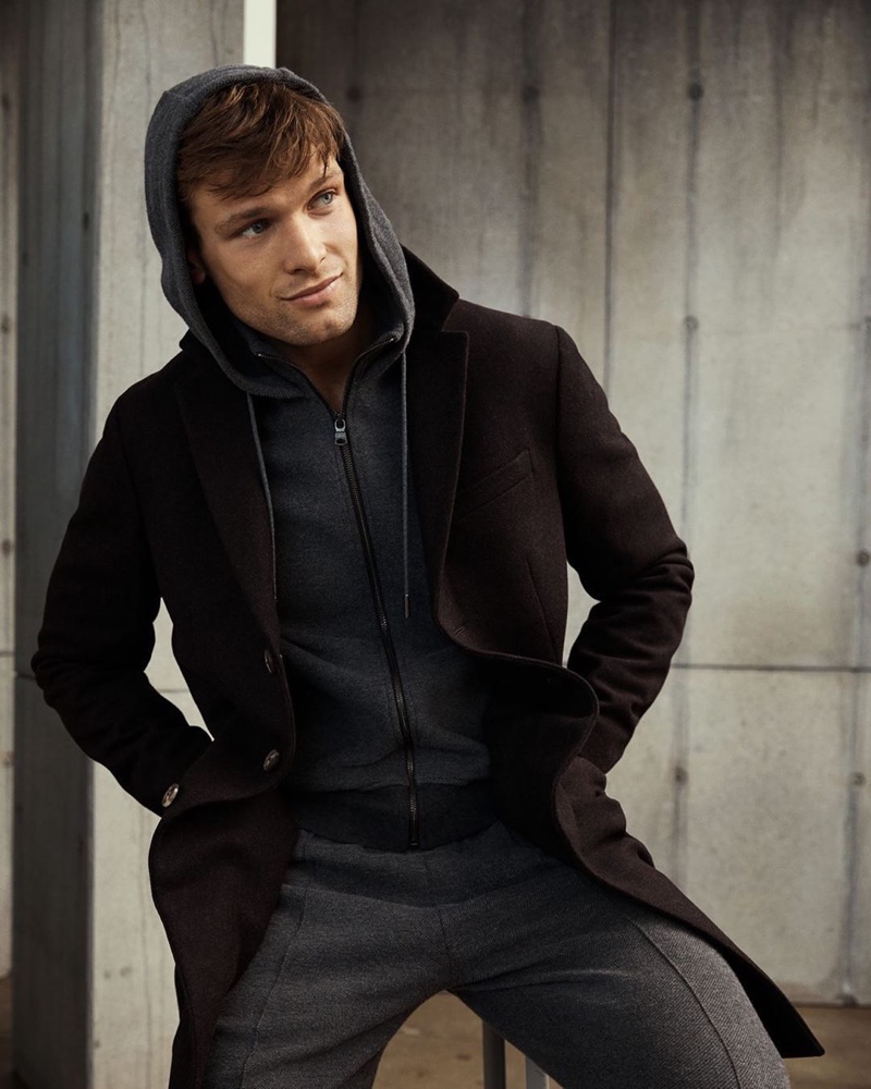 Sporting a full-zip hoodie and matching joggers, Elliott Reeder wears Banana Republic.