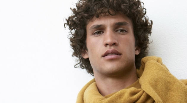 A chic vision, Francisco Henriques dons a gold long-sleeve mockneck tee $79.50 from Club Monaco.