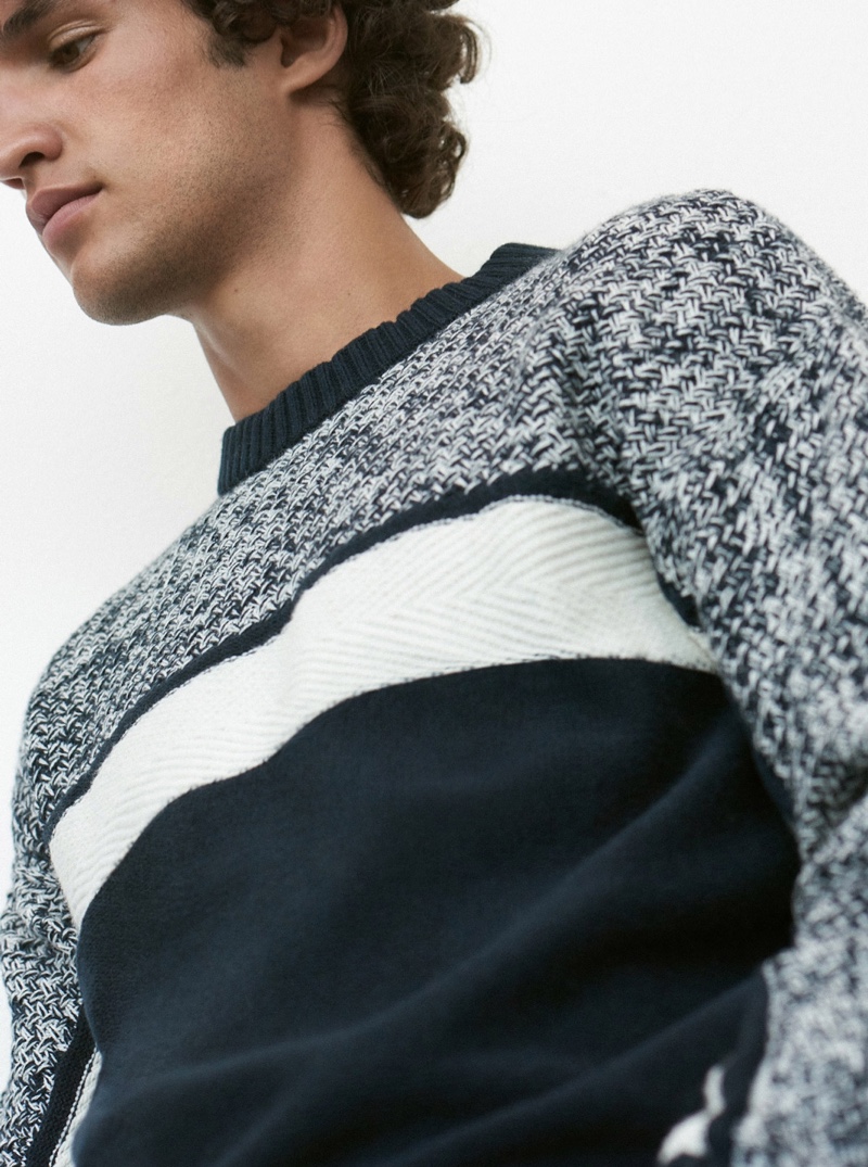 Making a graphic statement, Francisco Henriques wears a Club Monaco fisherman crewneck sweater $159.50.