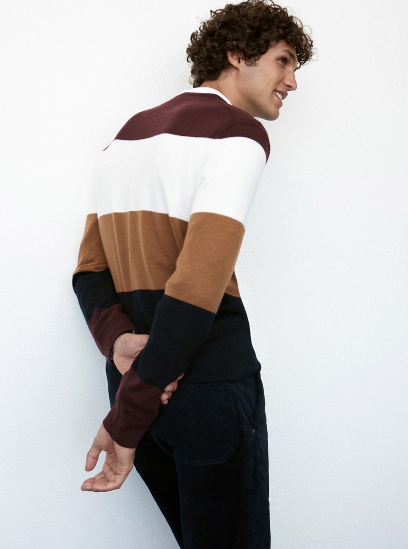 All smiles, Francisco Henriques dons a merino block stripe sweater $98.50 from Club Monaco.