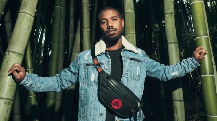 Actor Michael B. Jordan wears a leather belt bag and denim jacket from his Coach capsule collection.
