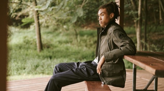 East Dane Embraces the Great Outdoors with Moose Knuckles Bracing for the cold, Seth Hill models a Moose Knuckles Pearson jacket with AMI trousers, a striped tee by Frame, and Converse Chuck Taylor All Star '70s high top sneakers.