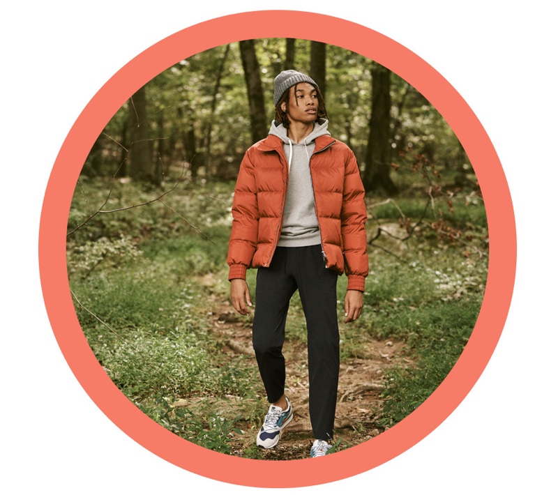 Front and center, Seth Hill sports a Moose Knuckles puffer jacket with a Barbour knit beanie. Reuniting with East Dane, he also wears a hoodie and pants by Reigning Champ with Karhu Synchron classic sneakers.