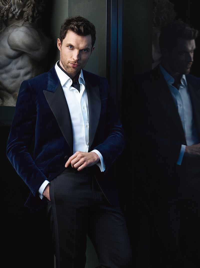 Donning a velvet dinner jacket, Ed Skrein appears in the Carolina Herrera Bad Boy fragrance campaign.