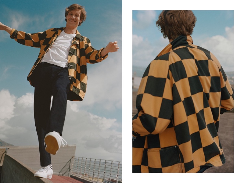 Sporting a checker print jacket, Felix Gesnouin stars in Esprit's fall 2019 campaign.