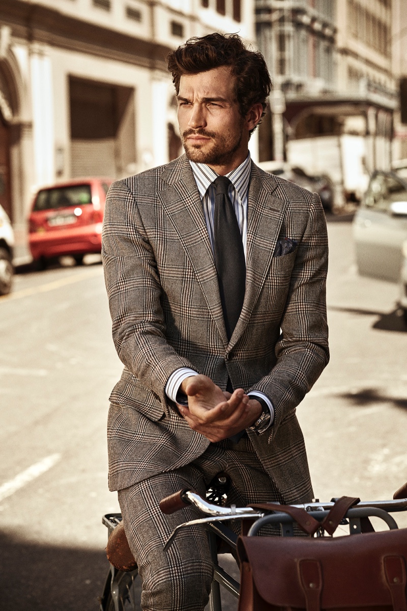 A sartorial vision, Paul Kelly dons a striped Eton shirt with a sharp suit.