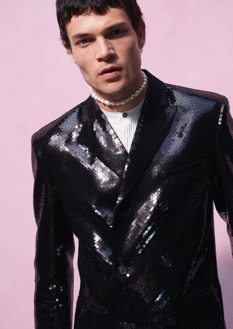 Going dandy, Luka Isaac dons a sequined double-breasted blazer from the Giambattista Valli x H&M collection.