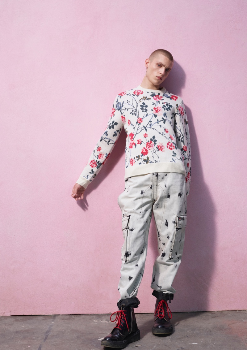 Tom Rey sports a floral print and bleach look from the Giambattista Valli x H&M collection.