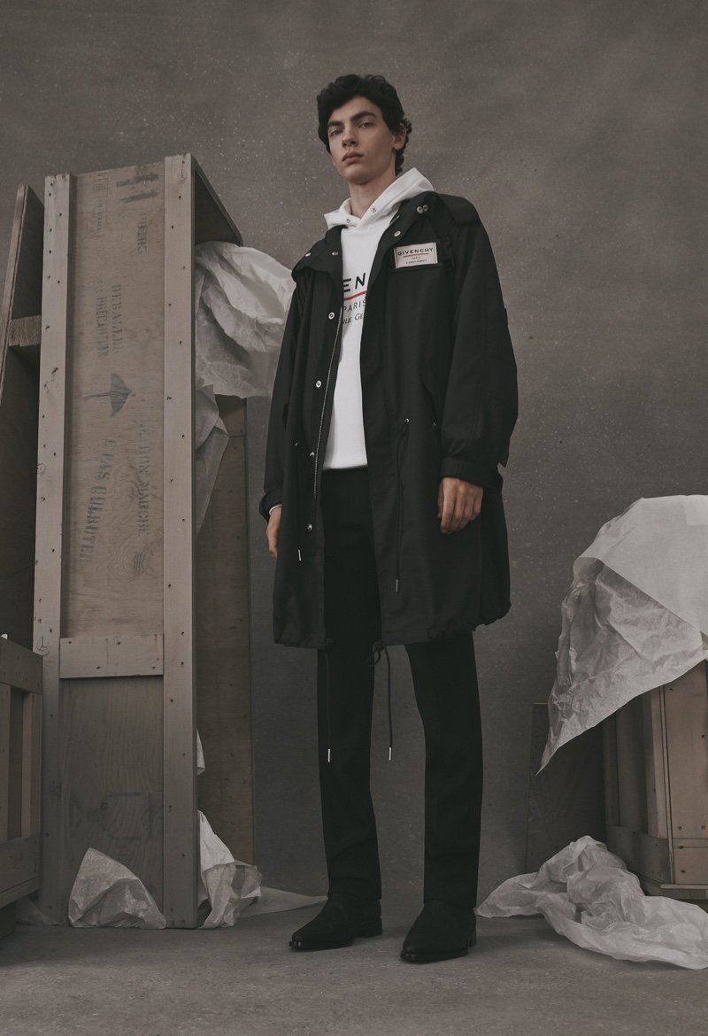 Going casual, Lev Uliesov dons a parka and hoodie from the Givenchy Atelier collection.