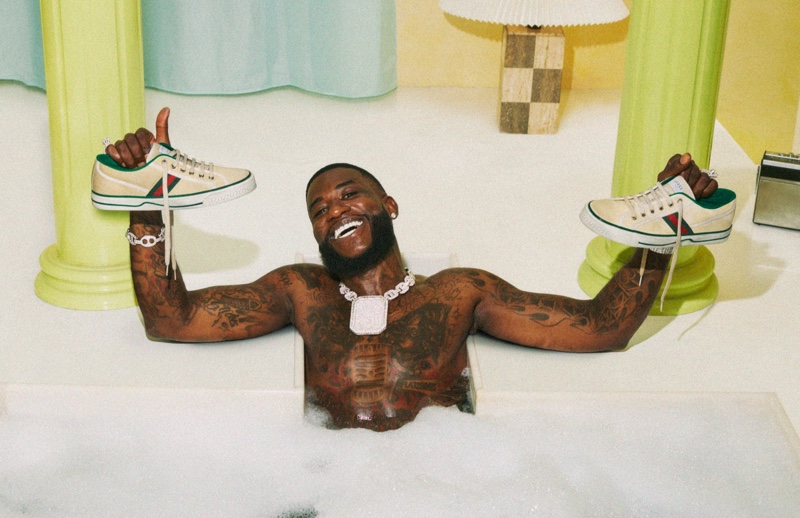 Enjoying a bubble bath, Gucci Mane poses with sneakers for Gucci's resort 2020 campaign.