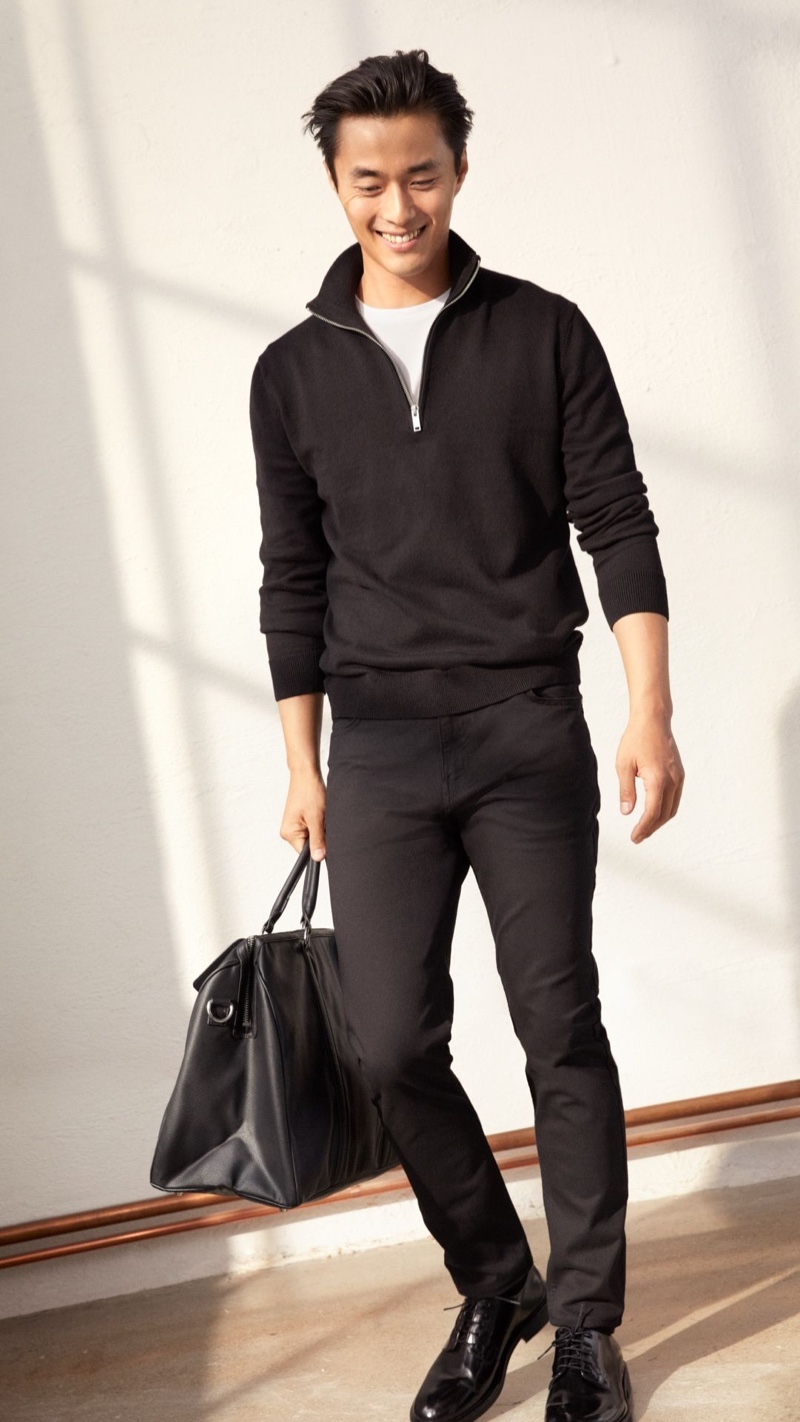 Going sporty, Zhao Lei models a pair of black pants with a half-zip pullover by H&M.