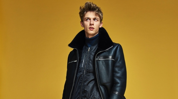 Front and center, Max Barczak dons a sleek black look from Karl Lagerfeld's fall-winter 2019 collection.