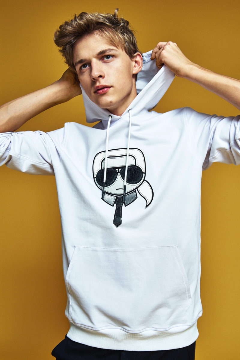 Sporting a hoodie with a Karl Lagerfeld graphic, Max Barczak appears in the brand's fall-winter 2019 lookbook.