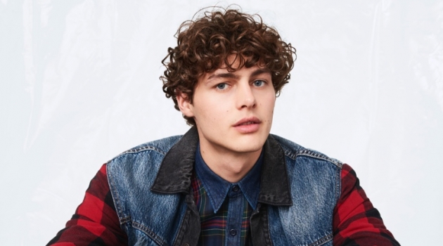 Darwin & Sua Rock Fall '19 Styles for Levi's Darwin Gray sports a denim and buffalo check jacket with a plaid shirt from Levi's fall-winter 2019 collection.