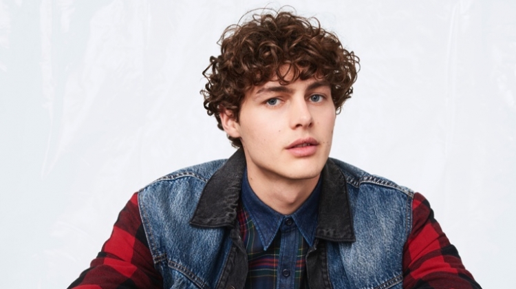 Darwin Gray sports a denim and buffalo check jacket with a plaid shirt from Levi's fall-winter 2019 collection.