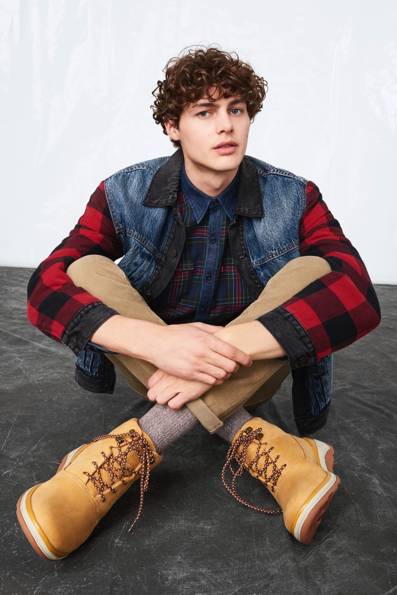 Darwin Gray sports a denim and buffalo check jacket with a plaid shirt from Levi's fall-winter 2019 collection.