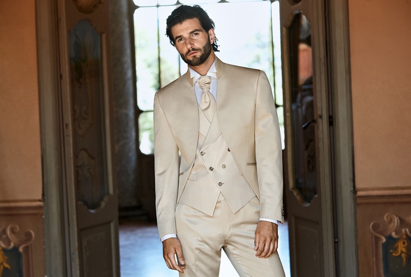 Standing out in a soft neutrals, Andrea Melchiorre charms in a dapper three-piece suit from Lubiam 1911 Cerimonia.