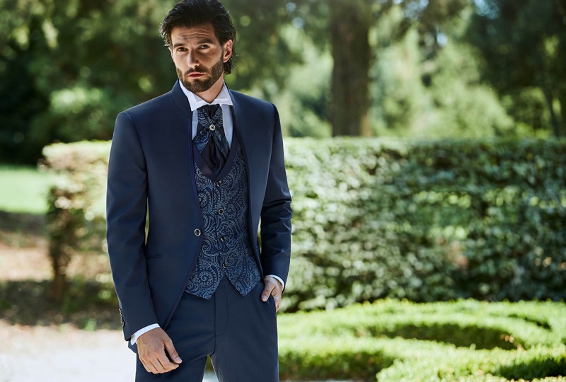 Sporting a paisley print waistcoat, Andrea Melchiorre models a spring-summer 2020 look from Lubiam 1911 Cerimonia.