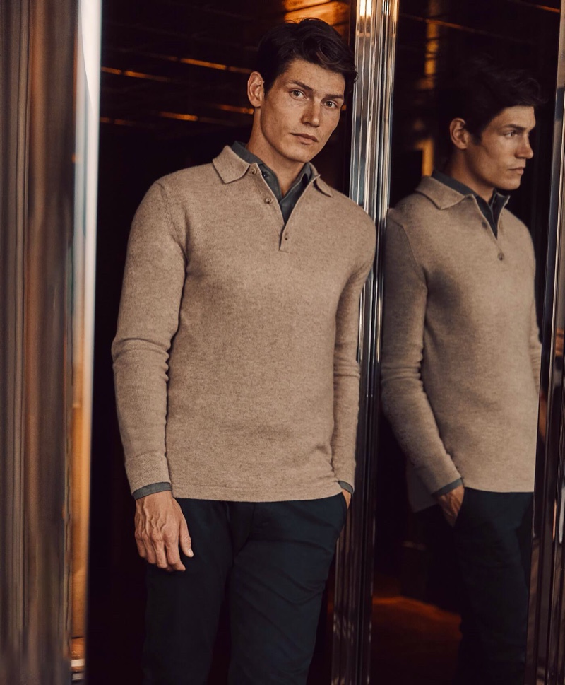 A smart vision, Sam Way wears Luca Faloni's camel beige cashmere polo sweater.