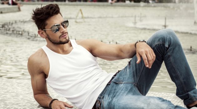 Finding the Fit: A Man's Guide to Jeans Male Model White Tank Top Jeans Aviator Sunglasses
