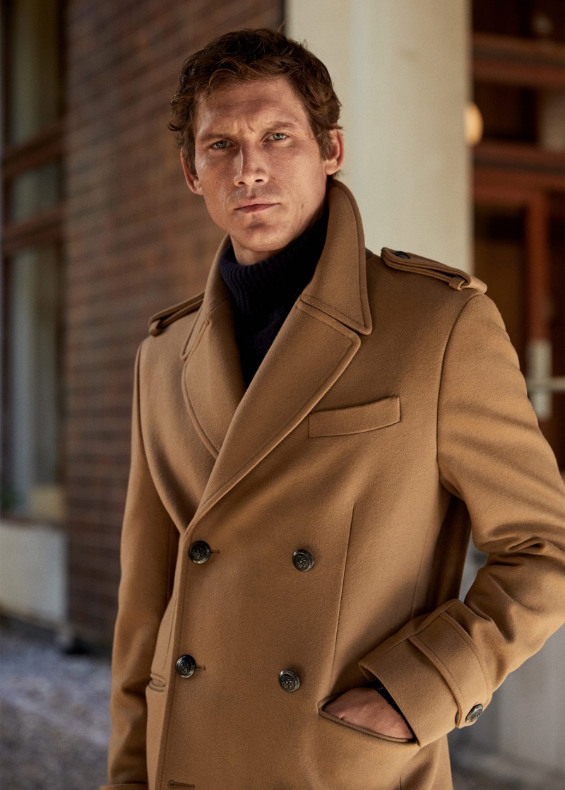 A chic vision, Roch Barbot sports a double-breasted camel coat from Mango.