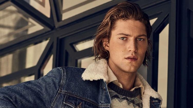 Boyd Gates sports a fairisle sweater with a denim trucker jacket from Mango.