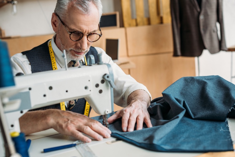 Older Man Sewing Glasses Grey Hair