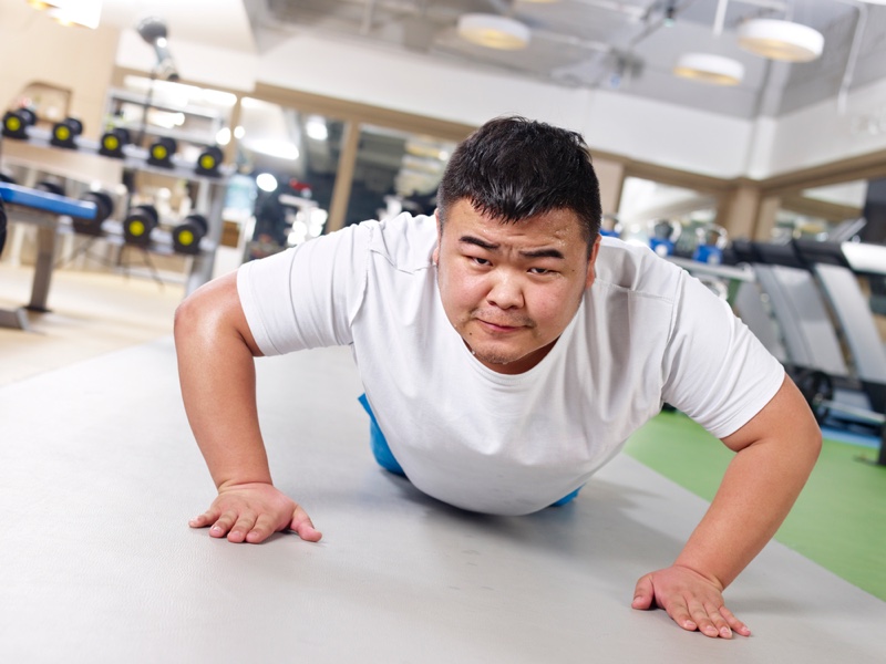 Overweight Man Pushups Exercise