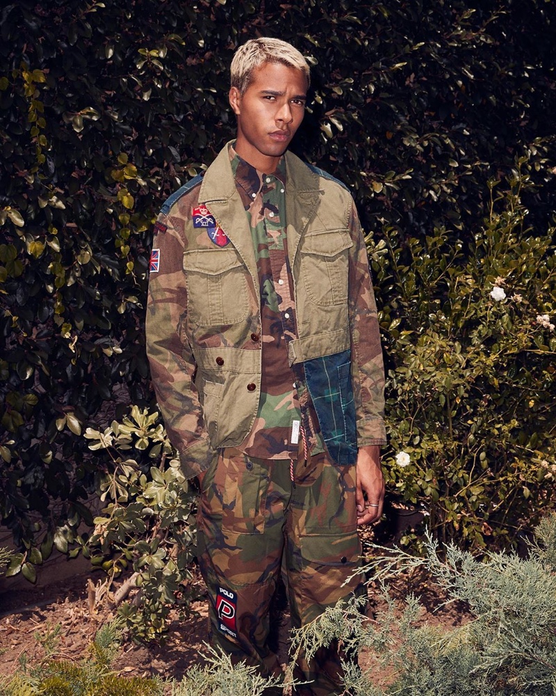 Embracing camouflage prints, Daouda Ka wears a POLO Ralph Lauren oxford shirt $98, hybrid jacket $498, and pants $188.