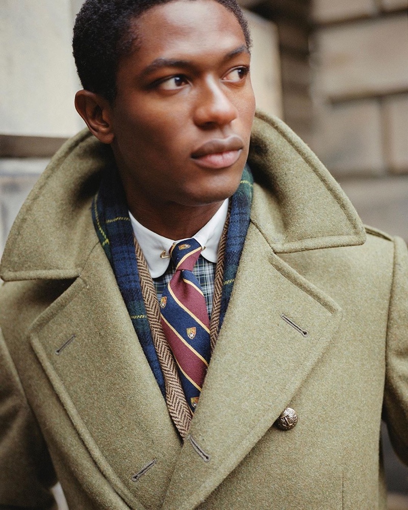Hamid Onifade is a striking vision in a sharply tailored coat from POLO Ralph Lauren.