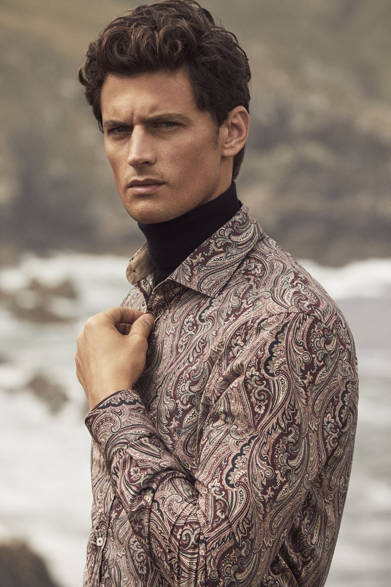 Connecting with Pedro del Hierro for its winter 2019 campaign, Garrett Neff sports a paisley print shirt.