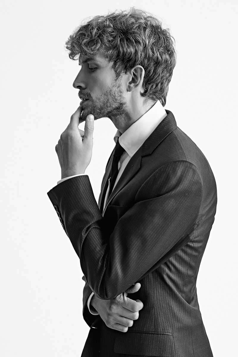 Rasmus wears shirt Tom Ford, tie Prada, and suit jacket Dior.