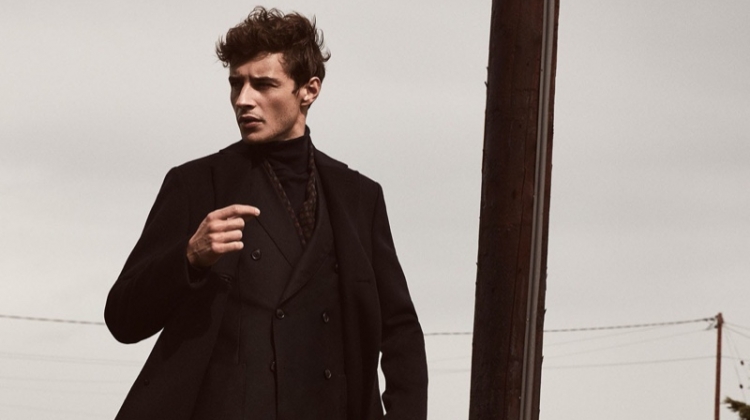French model Adrien Sahores sports Reiss' Gable wool epsom overcoat $545 in navy.