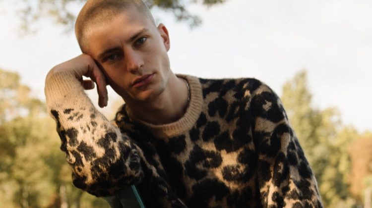 Lucas Berny sports a leopard print sweater from Reserved.