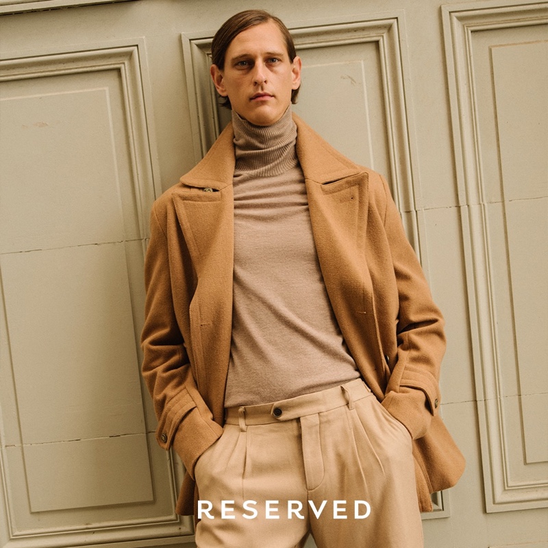 Making a case for monochromatic style, Rogier Bosschaart models a camel coat by Reserved.