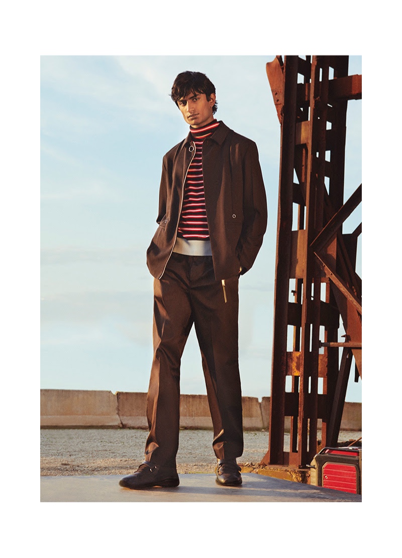 Rishi Robin stands by graphic style in a striped Marni turtleneck sweater with Calvin Klein pants.