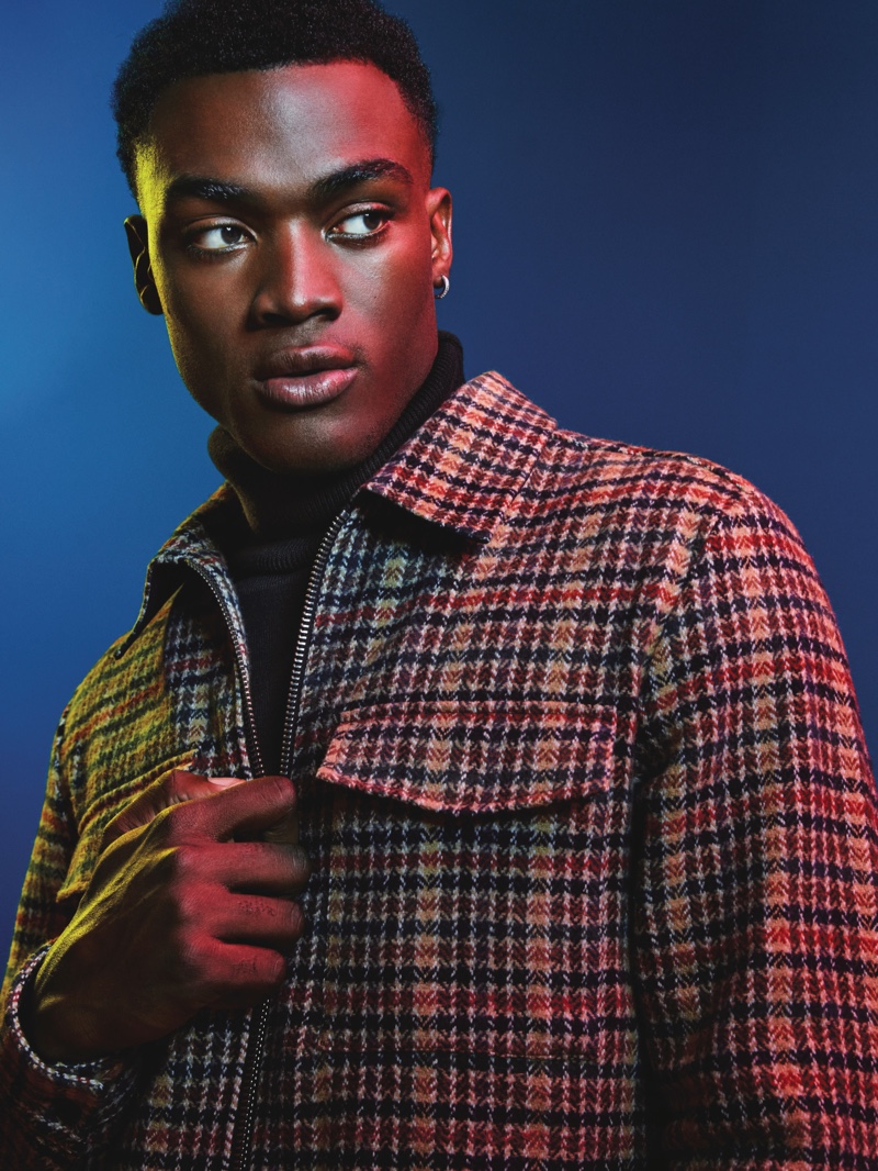 Davidson Obennebo sports a houndstooth print jacket from River Island's Electric Xmas collection.