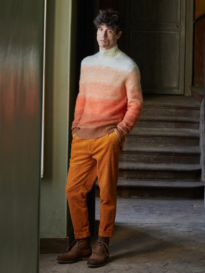 Making a case for orange, Nicolas Ripoll wears a Scotch & Soda gradient knit turtleneck $195 with corduroy trousers $165.