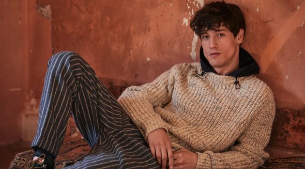 Bold New Fall: Nicolas Ripoll Inspires in Scotch & Soda A chic vision, Nicolas Ripoll sports a Scotch & Soda hooded sweater $198 and wool blend trousers $165.