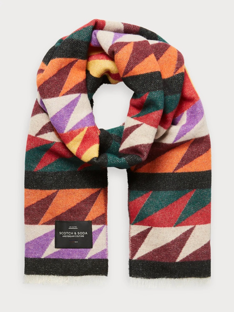 Peruvian influences shine through in this alpaca sweater and bold print geometric scarf. 