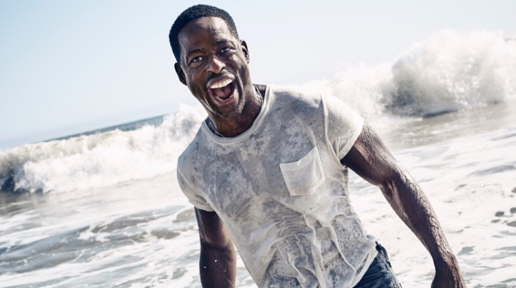 All smiles, Sterling K. Brown wears a Levi's Vintage Clothing t-shirt with Levi's jeans and a John Varvatos necklace.