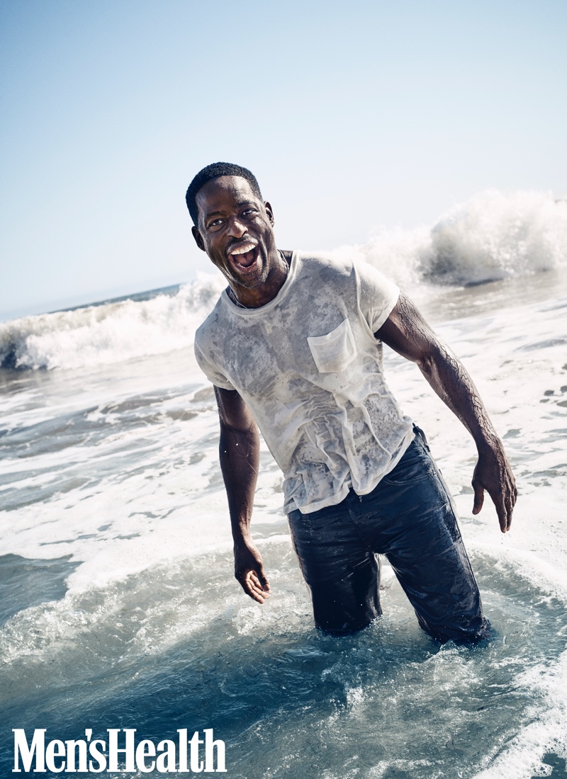 All smiles, Sterling K. Brown wears a Levi's Vintage Clothing t-shirt with Levi's jeans and a John Varvatos necklace.