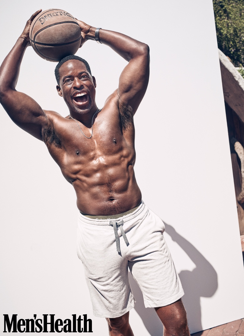 Going shirtless to show off his six-pack, Sterling K. Brown sports Gap shorts with Adidas x Missoni sneakers and a John Varvatos necklace.
