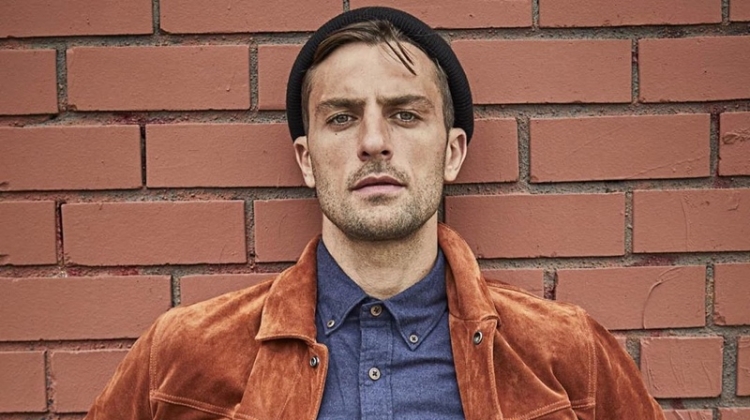Standing out in a beautiful rust color, Rafael Lazzini dons a Todd Snyder Italian suede jacket $998 with a brushed cotton cashmere shirt $178 in navy and distressed denim jeans.