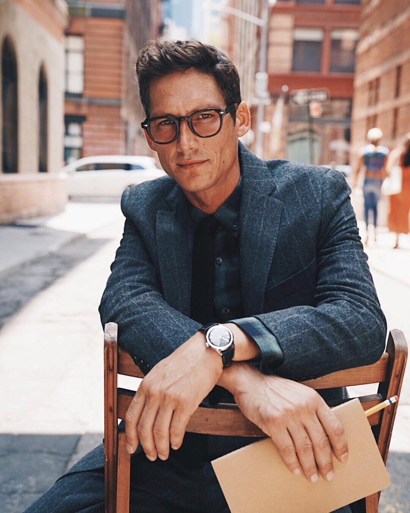 Donning glasses, Roch Barbot wears a Todd Snyder wool chalk stripe Sutton suit $786 in charcoal.