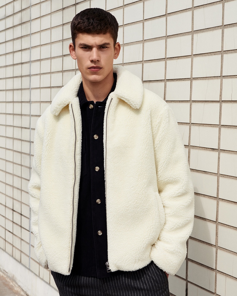 Sporting a white fleece jacket, Finn Hayton stars in Topman's fall 2019 campaign.