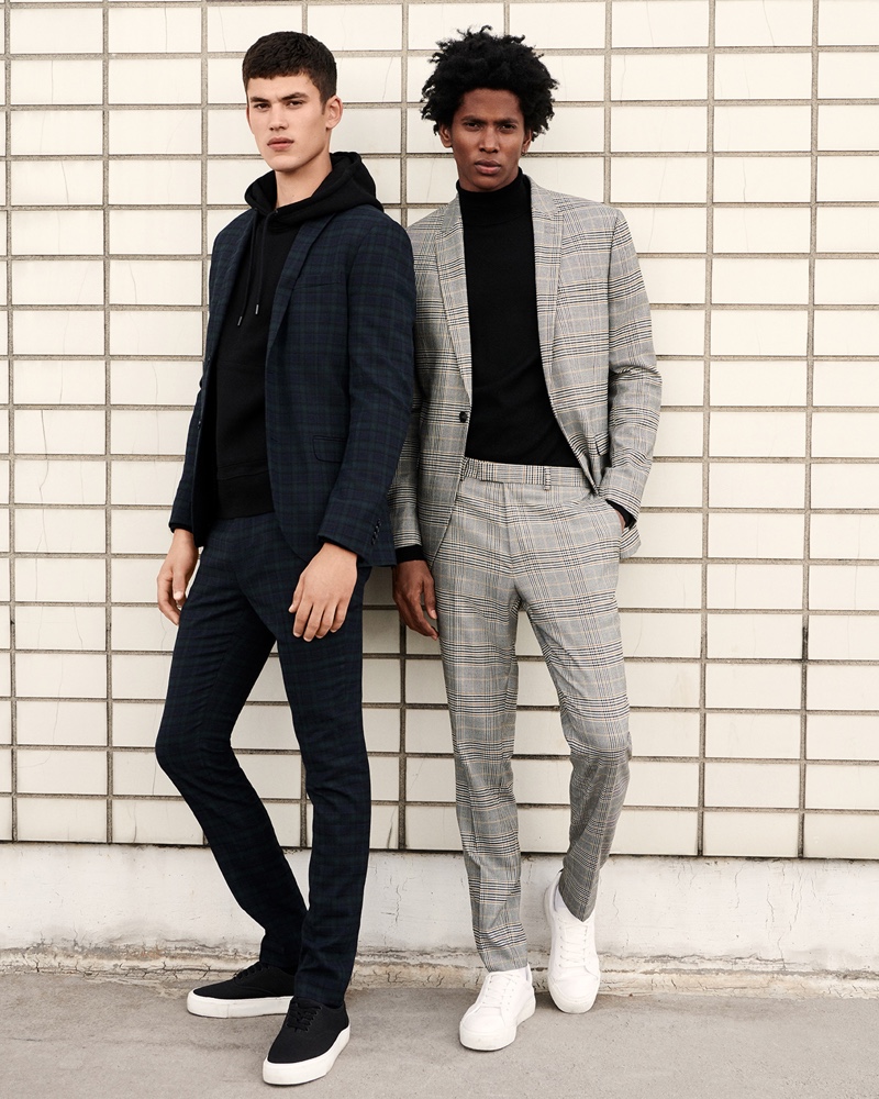 Sporting checked suits, Finn Hayton and Rafael Mieses star in Topman's fall 2019 campaign.