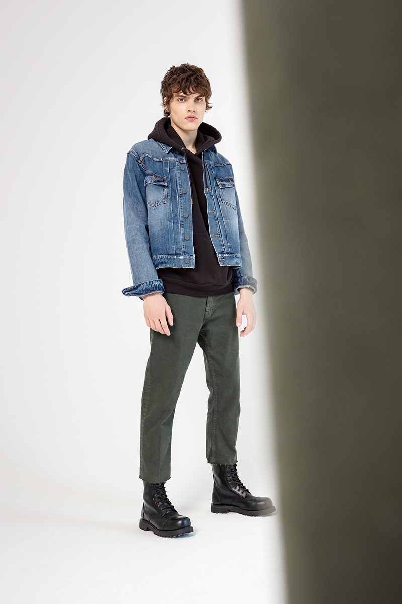 Philip Lunin models denim fashions from Two Men's fall-winter 2019 collection.