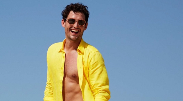 Sam Webb Charms in Vilebrequin Cruise '20 Collection All smiles, Sam Webb dons a yellow linen Vilebrequin shirt $250 with Bateaux Sur L'eau swim trunks $260.