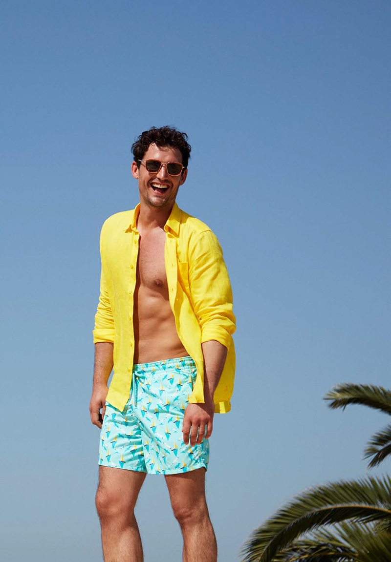 All smiles, Sam Webb dons a yellow linen Vilebrequin shirt $250 with Bateaux Sur L'eau swim trunks $260.